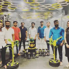 The full team celebrating a gym milestone. We believe in marking our progress and enjoying the journey together. This is the spirit of our fitness family.