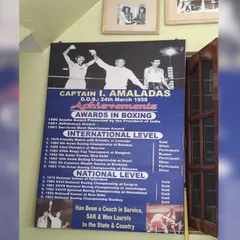 This is the legacy we train under. A poster detailing the achievements of Captain I. Amaldas, an Arjuna Awardee and international boxer. We are rooted in a history of excellence.