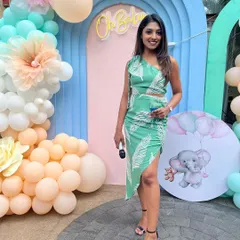 A smiling photo with the mic in hand at the baby shower.