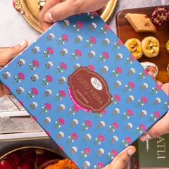 Packaging is a key part of the product experience. In this shot, we focused on the human element of gifting, showing hands exchanging a beautifully designed box of fresh sweets from Guru Kripa.