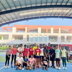 The PBI family celebrates a player's AITA Doubles Championship. Her victory is a victory for the entire team that supported her journey.