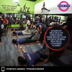 Flexibility and mobility are just as important as strength. Here, our students are engaged in a hands-on practical coaching class, learning and practicing various stretching exercises to improve range of motion and prevent injuries.
