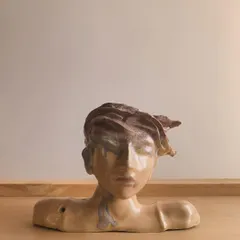A finished bust by self taught artist Sudipto, who uses our kiln firing services. This piece showcases incredible detail and emotion, proving that passion and dedication are the most important tools for an artist.