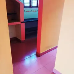 Looking from the hallway into the kitchen area of a recently completed project. The client chose a vibrant color scheme that we applied carefully across different walls and structures.