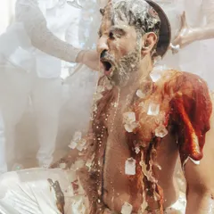 The pure, unadulterated joy of a Haldi ceremony. This moment, with ice and champagne, captures the wild, fun-loving spirit we love to bring to traditional rituals, making them uniquely yours.