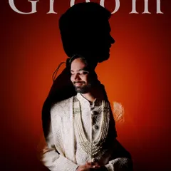 An artistic double-exposure portrait of the groom, blending his silhouette with a full-length shot of him in his sherwani.