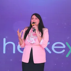 Addressing the audience at AccelHERate. I use storytelling to connect with younger audiences and make complex topics more engaging.