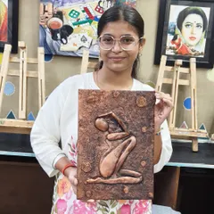 The artist and her creation. This relief panel is a perfect example of the stunning wall decor you can learn to make in our 3D art classes.