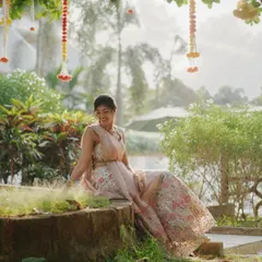 Captured in a moment of quiet joy. This soft glam look is designed to be timeless, enhancing her features without overpowering them, perfect for creating lasting memories.
