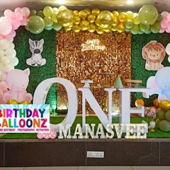 I designed this gentle jungle theme with a mix of soft pink and green balloons. The setup includes a gold sequin backdrop, cute animal cutouts, a picket fence, and a large "ONE" table, creating a sweet and inviting look for a first birthday.