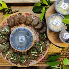 Our vegetarian Kebab Platter is perfect for starting a meal. It features two types of handmade kebabs, Matar Tikki and Galouti Kebab, served with green chutney and other toppings for a complete experience.