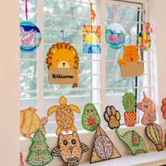 Look at this window full of sunshine and creativity! This is just a sample of the amazing mosaic art and painted wooden decor you can make. Each piece is a little burst of joy, ready to brighten up your space.