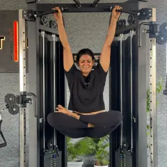 Sometimes you just have to monkey around. I love incorporating Padmasana into unexpected places, like hanging from a pull-up bar. It's a playful way to challenge my core and hip flexibility.