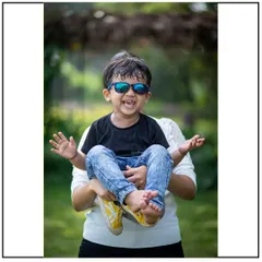 The pure, uninhibited laughter of a child is the best thing to capture. This playful moment during a family session shows the joyful, chaotic energy I love.