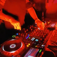 A close-up of my hands on the mixer during a Bolly-Tech set. This genre requires precise control to blend the different elements of Bollywood and techno seamlessly.