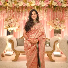 A quick change for the reception, from a traditional Marathi bride to a modern glam look. This shows how we can create multiple distinct styles for your different wedding events, complete with soft curls and elegant makeup.