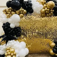 This glamorous party backdrop uses a gold sequin wall as its base. The balloon arrangement in black, white, and chrome gold creates a bold and high-contrast look, perfect for a milestone birthday or a New Year's Eve party.