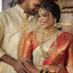 The look of love. This tender moment between the South Indian bride and groom is what wedding dreams are made of. Her makeup is soft and natural, letting her emotions shine.