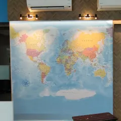 A world map mural is a classic choice for corporate offices, especially for companies with a global presence. I make sure to work around AC units and lights for a clean look.