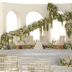A wide shot of the modern, all-white mandap I designed at the Taj Holiday Village, Goa. The clean lines and ocean view create a picture of serene, contemporary elegance.