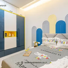 For this boy's room, I used a playful arched wall panel design behind the bed in shades of blue and yellow. The "Happiness Is" bedsheet adds to the cheerful and positive vibe of the space.