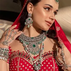 A close-up on the model's expression and the stunning necklace. In jewellery photography, the model's look must complement the product, and we direct them to achieve that perfect synergy.