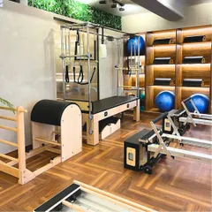 Here you can see how I've integrated different types of equipment, including Pilates reformers, ladder barrels, and stability balls. This variety allows us to create well-rounded fitness plans tailored to your goals.