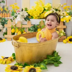 A big, happy smile from the tub. The combination of the warm bath and fun toys always brings out the best expressions.