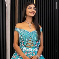 A smiling client looking radiant in our blue fairytale gown. We love seeing our clients light up when they find the perfect outfit for their special occasion.
