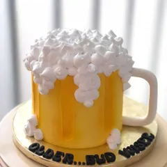 Cheers to another year! This fun and realistic beer mug cake is a great surprise for a beer lover's birthday, with "foam" made of buttercream.