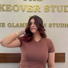 From simple to stunning. This client is owning her vibe with a bold red transformation, complete with soft curls to show off the color's dimension.