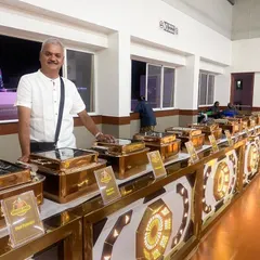 Here is a look at our full buffet setup for a large wedding reception. We use elegant copper-lidded chafing dishes to keep every dish warm and presentable, ensuring a seamless dining experience for hundreds of guests. I personally oversee the arrangement to make sure it reflects the grandeur of your special day.