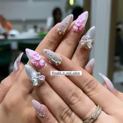 An example of our detailed 3D nail art. This set includes sculpted pink acrylic flowers and sparkling butterfly charms made of Swarovski crystals, all set on long, elegant stiletto extensions for a truly show-stopping effect.