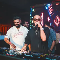 Taking the mic to hype up the crowd during my B2B set with Nikhil Chinapa. It's about creating a party atmosphere and making sure everyone feels connected to the music.