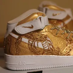A touch of gold. This is my original take on Nike's "Dragon of the Year" theme. I used a satin gold base and fine glitter to create the dragon, giving these AF1 mids a luxurious and textured look.