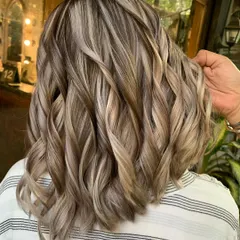 A true blonde bombshell. This look was created with a full head of highlights and a fresh cut, using bleach to achieve this bright, beautiful platinum blonde.