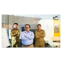 A commercial shot depicting a small business owner with his team in a factory setting. This image was created for a business loan campaign to tell a story of growth and partnership.