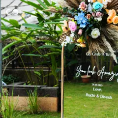 A fun and interactive detail for guests. We set up this custom mirror with an encouraging message, topped with a vibrant floral arrangement, creating the perfect spot for a photo opportunity.