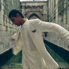 A motion shot that captures the fluid movement of the layered jacket. Even in menswear, I like to show how the garments move and live on the body.