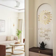 This mandir is a key highlight of the dining area, exuding divinity amidst modern luxury. The design features the Om symbol in golden letters and an inscribed mantra on a white arched panel.