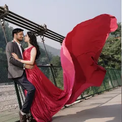 A dramatic pre-wedding portrait on one of Rishikesh's iconic bridges. We create cinematic, magazine-worthy images that tell your epic love story.
