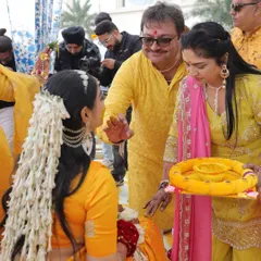A moment during the Haldi rituals. My hair is adorned with beautiful mogra flowers, a traditional and fragrant accessory that perfectly complements the yellow saree and silver jewelry.