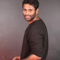 A candid shot from a photoshoot. I believe in leading with a smile and plenty of positive energy.