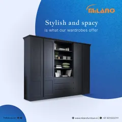 Our wardrobes are designed to be both stylish and spacious. This dark blue unit features an open central shelving section for display items, flanked by closed cabinets, offering a perfect blend of concealed and open storage.