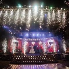 A stage fit for a show-stopping performance. I designed this multi-level stage with a massive lighting rig and cold-pyro effects to create a high-energy, concert-like feel for the Sangeet night.