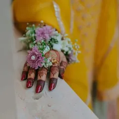 The deep stain of my henna looks beautiful when paired with floral jewelry. This is a popular combination for Haldi and Mehandi ceremonies, and the dark color of the henna provides a stunning contrast.