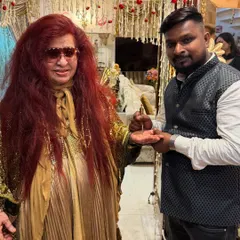 Here I am applying a small design for the legend, Shahnaz Husain. It was a privilege to share my art with the "Queen of Beauty" herself.