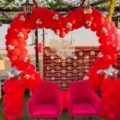 A 'Better Together' terrace setup with a heart-shaped red balloon arch, perfect for a romantic date or anniversary.