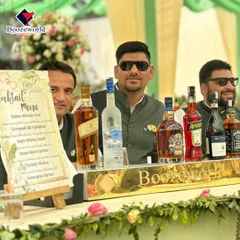 Our team, dressed for a sophisticated wedding, stands proudly behind a fully stocked bar. We ensure our staff's appearance and professionalism match the elegance of your event.