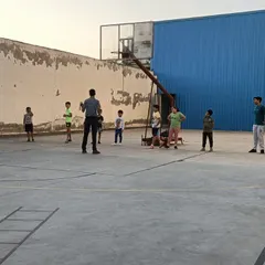 A group of young players gathered on the court to receive instructions from the coach. Clear communication and strategy are a big part of my coaching philosophy.
